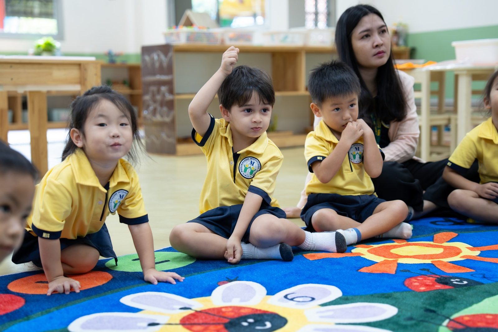 Preschool 2 children counting with a teacher